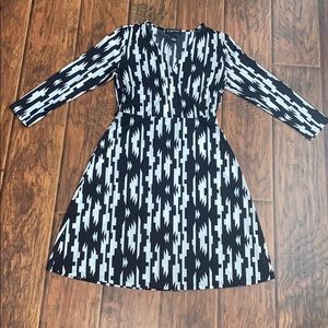 INC black and white long sleeve cross body dress.